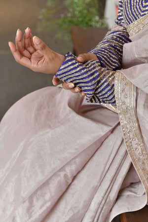 Metallic Pink Tissue Saree paired with Printed Blouse.