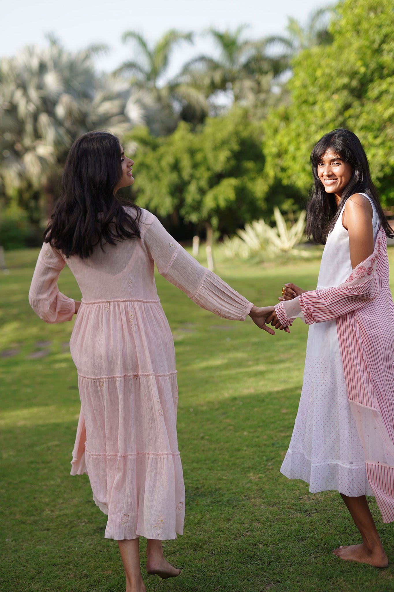 Light Pink Cotton Crush Tiered Midi Dress With Floral Embroidery Details.